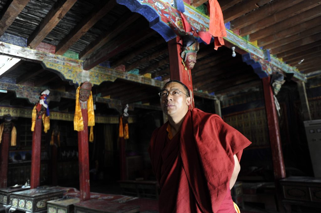 In this photo taken on June 16, 2016, Nepalese monk Khenpo Kunga Tenzin, head of Lo Manthang's Monchoe Dragkar Thegchen Ling monastery, speaks during an interview with AFP in Lo Manthang in Upper Mustang. A Himalayan Shangri-La that was closed to visitors until 1992, the former Buddhist kingdom of Upper Mustang in Nepal is facing unprecedented change as a new highway brings modernity to the roof of the world. - TO GO WITH AFP STORY NEPAL-TIBET-CULTURE-RELIGION-ROYALS,FEATURE BY AMMU KANNAMPILLY  / AFP / PRAKASH MATHEMA / TO GO WITH AFP STORY NEPAL-TIBET-CULTURE-RELIGION-ROYALS,FEATURE BY AMMU KANNAMPILLY