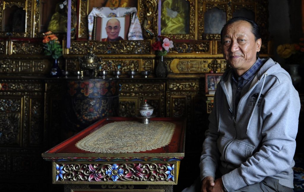 In this photo taken on June 18, 2016, former crown prince from Mustang, Jigme Singi Palbar Bista, poses during an interview with AFP in Lo Manthang in Upper Mustang. A Himalayan Shangri-La that was closed to visitors until 1992, the former Buddhist kingdom of Upper Mustang in Nepal is facing unprecedented change as a new highway brings modernity to the roof of the world. - TO GO WITH AFP STORY NEPAL-TIBET-CULTURE-RELIGION-ROYALS,FEATURE BY AMMU KANNAMPILLY  / AFP / PRAKASH MATHEMA / TO GO WITH AFP STORY NEPAL-TIBET-CULTURE-RELIGION-ROYALS,FEATURE BY AMMU KANNAMPILLY